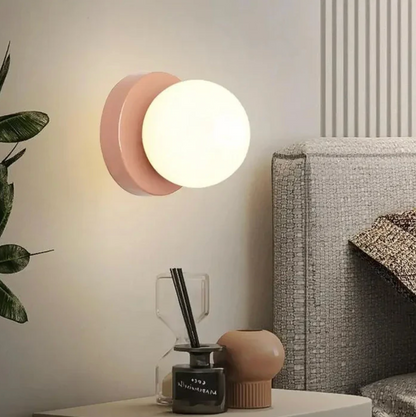 A modern wall sconce with a spherical shade – a minimalist design for interiors 1