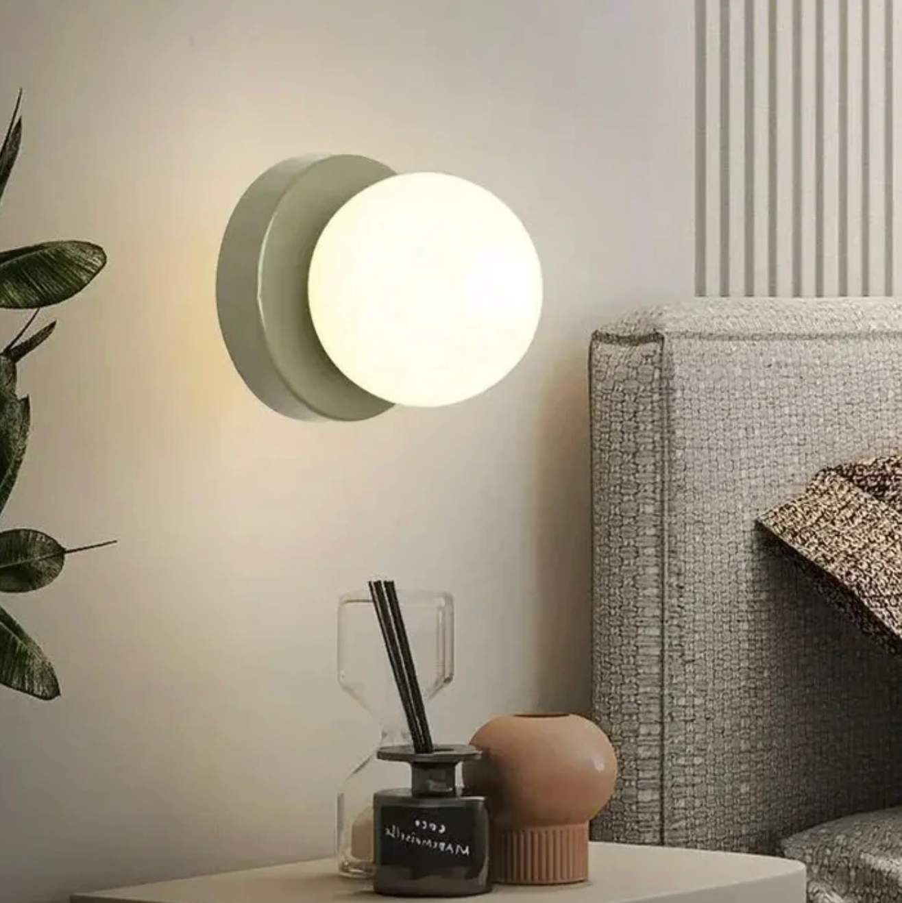 A modern wall sconce with a spherical shade – a minimalist design for interiors 2