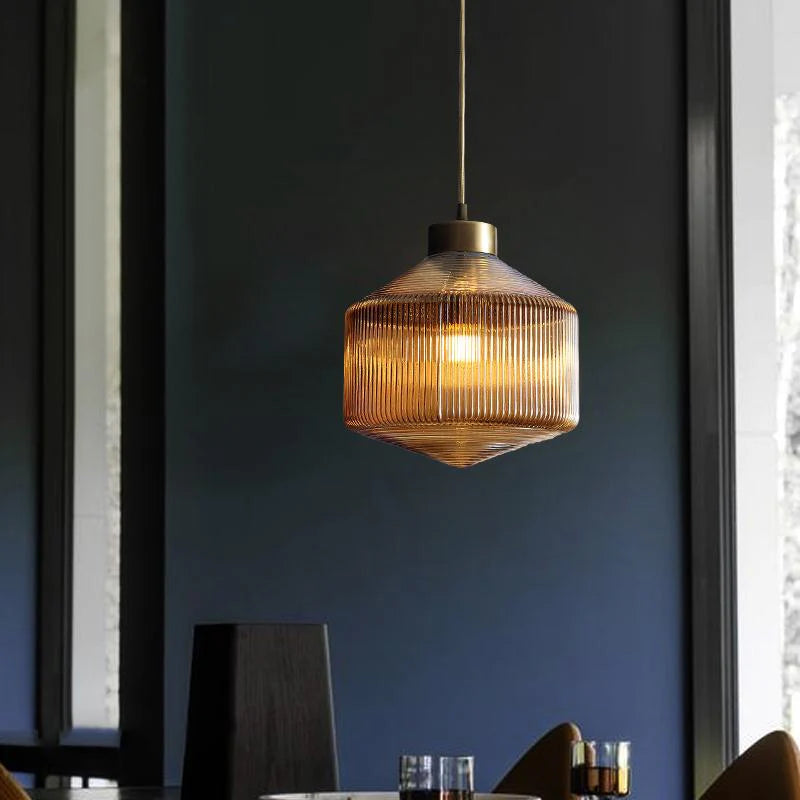 An elegant glass pendant lamp with a grooved shade 0
