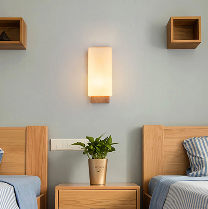 Wooden wall sconce with a frosted shade – a modern lamp for the bedroom 2