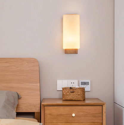 Wooden wall sconce with a frosted shade – a modern lamp for the bedroom 4