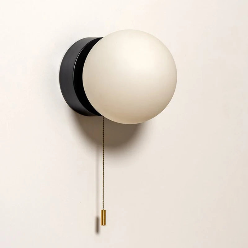 Wall sconce with a spherical shade and chain – modern elegance in a minimalist form 0