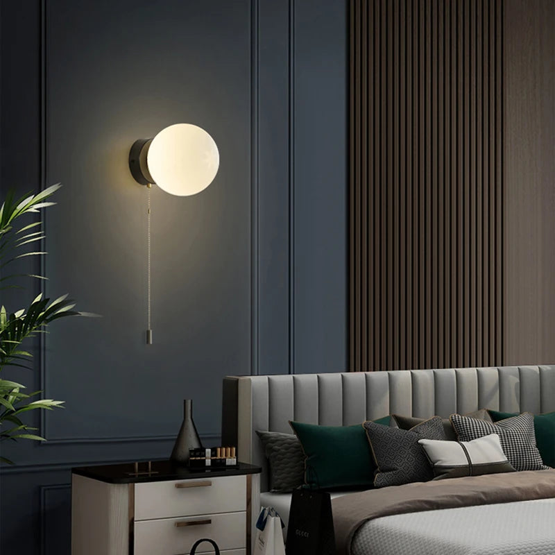 Wall sconce with a spherical shade and chain – modern elegance in a minimalist form 2