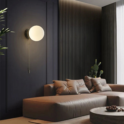 Wall sconce with a spherical shade and chain – modern elegance in a minimalist form 3