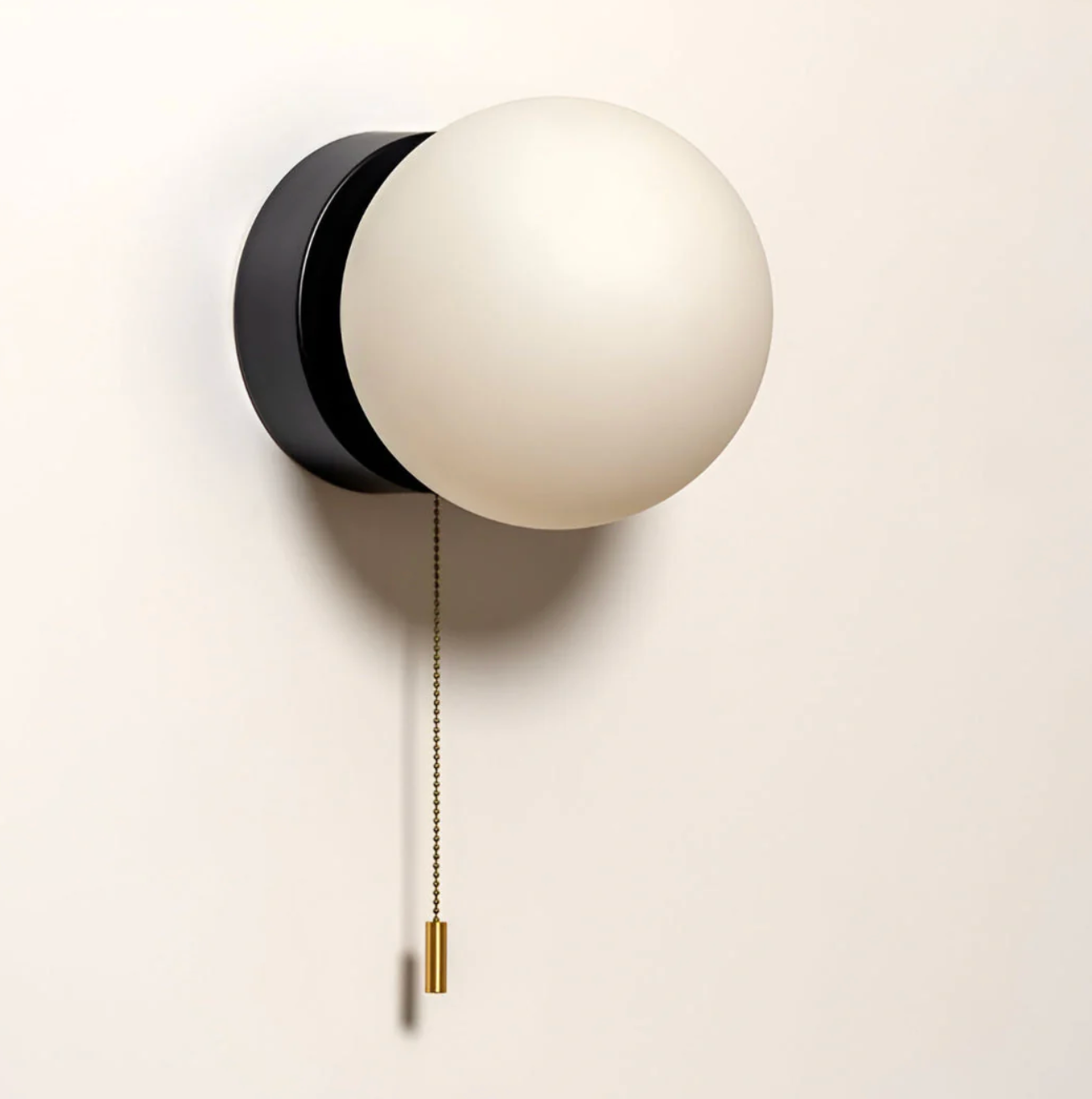 Wall sconce with a spherical shade and chain – modern elegance in a minimalist form 5