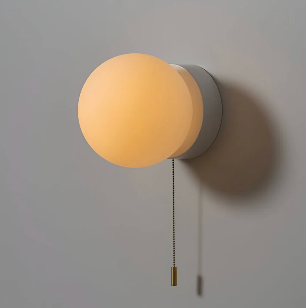 Wall sconce with a spherical shade and chain – modern elegance in a minimalist form 6