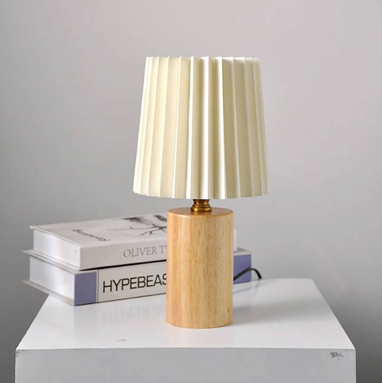 A modern table lamp with a wooden base and a pleated shade – a Scandinavian-style bedside lamp 8
