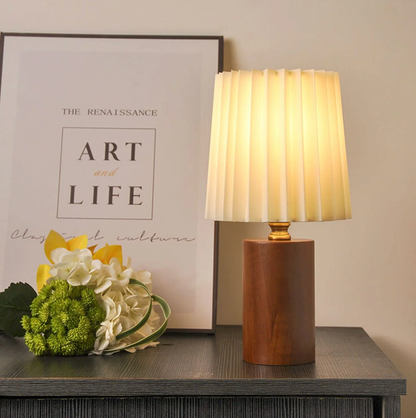 A modern table lamp with a wooden base and a pleated shade – a Scandinavian-style bedside lamp 1
