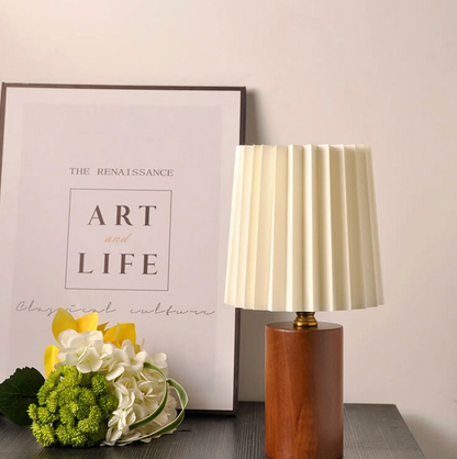 A modern table lamp with a wooden base and a pleated shade – a Scandinavian-style bedside lamp 2