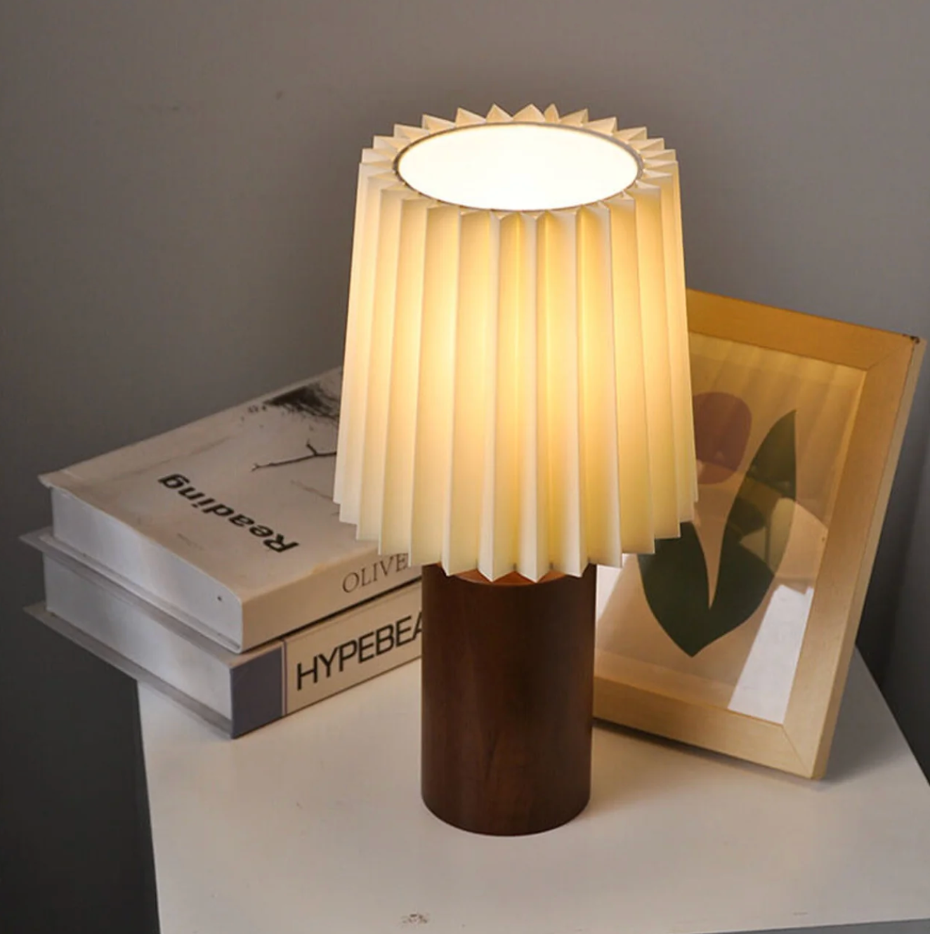 A modern table lamp with a wooden base and a pleated shade – a Scandinavian-style bedside lamp 4
