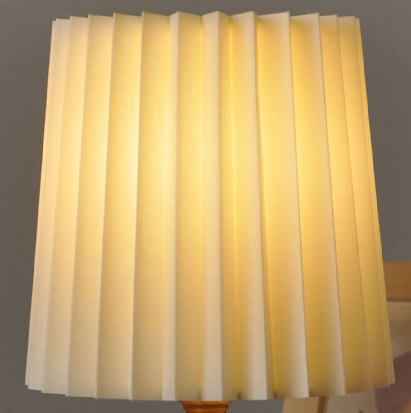 A modern table lamp with a wooden base and a pleated shade – a Scandinavian-style bedside lamp 5