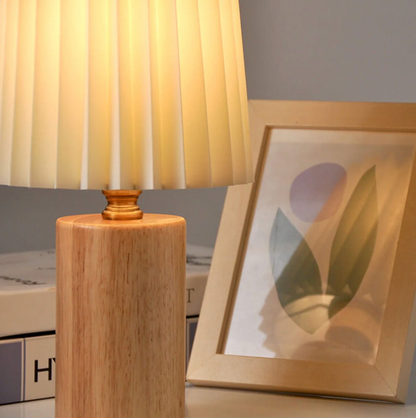 A modern table lamp with a wooden base and a pleated shade – a Scandinavian-style bedside lamp 6