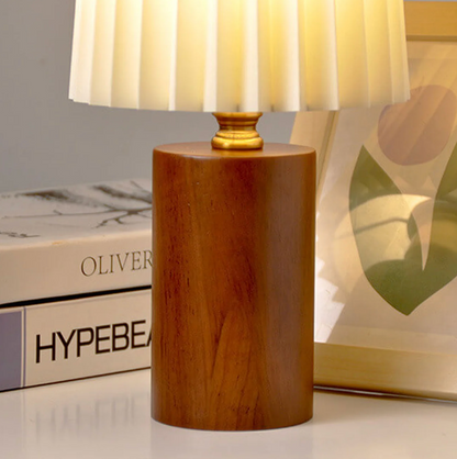 A modern table lamp with a wooden base and a pleated shade – a Scandinavian-style bedside lamp 7