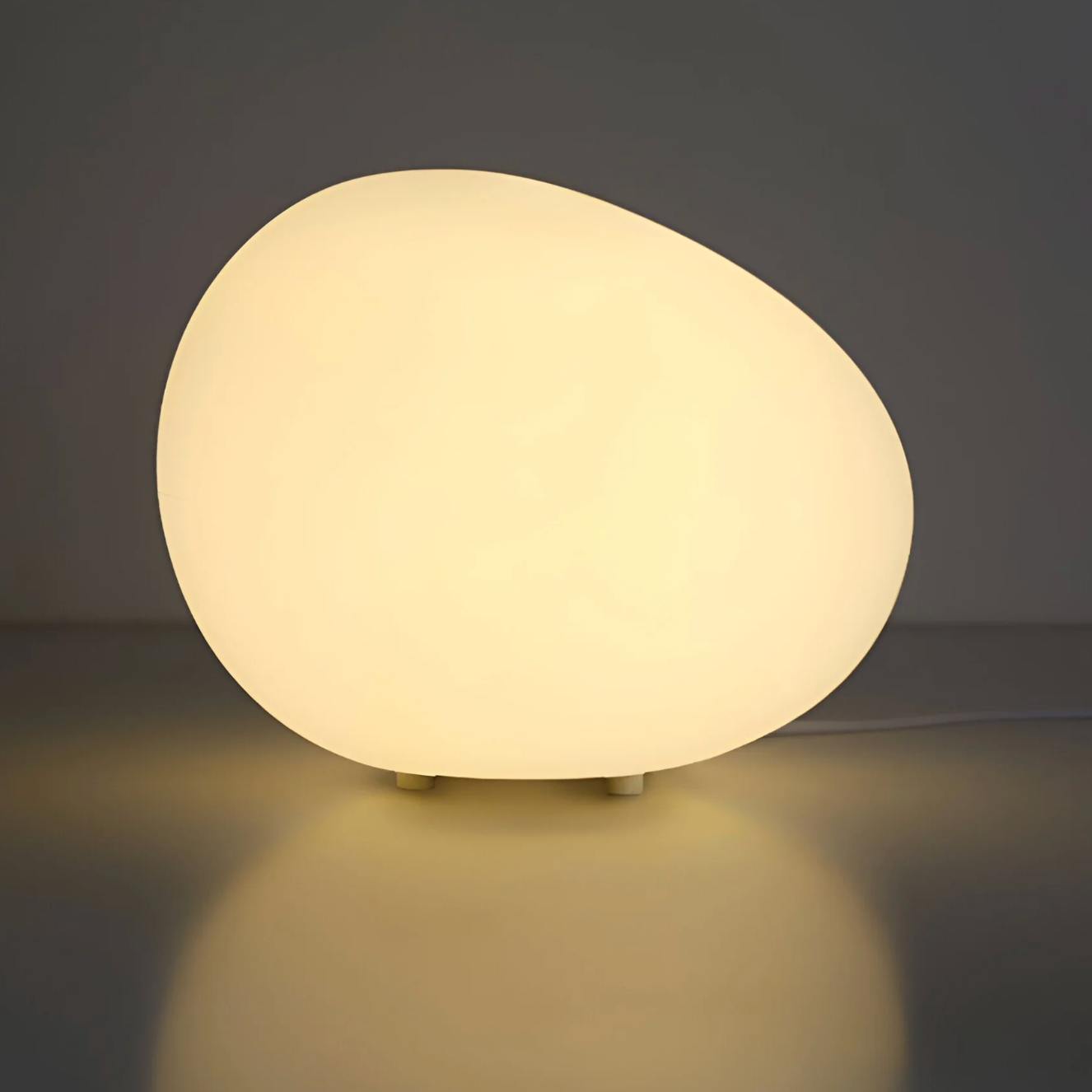 Stone-shaped table lamp – minimalist elegance in an organic form 0