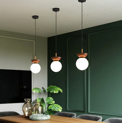 A ceiling or pendant lamp with a frosted shade and a wooden accent – minimalist elegance for any interior 7