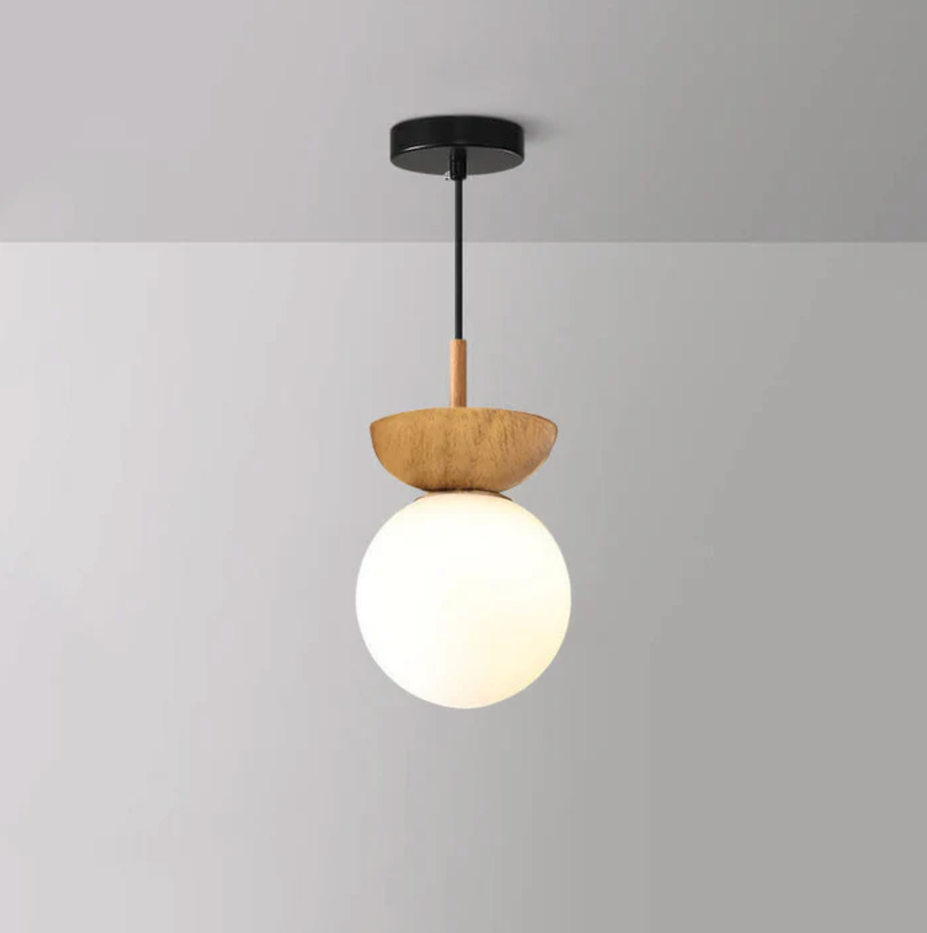 A ceiling or pendant lamp with a frosted shade and a wooden accent – minimalist elegance for any interior 2