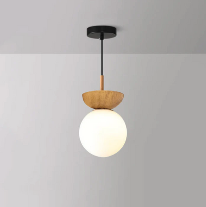 A ceiling or pendant lamp with a frosted shade and a wooden accent – minimalist elegance for any interior 2