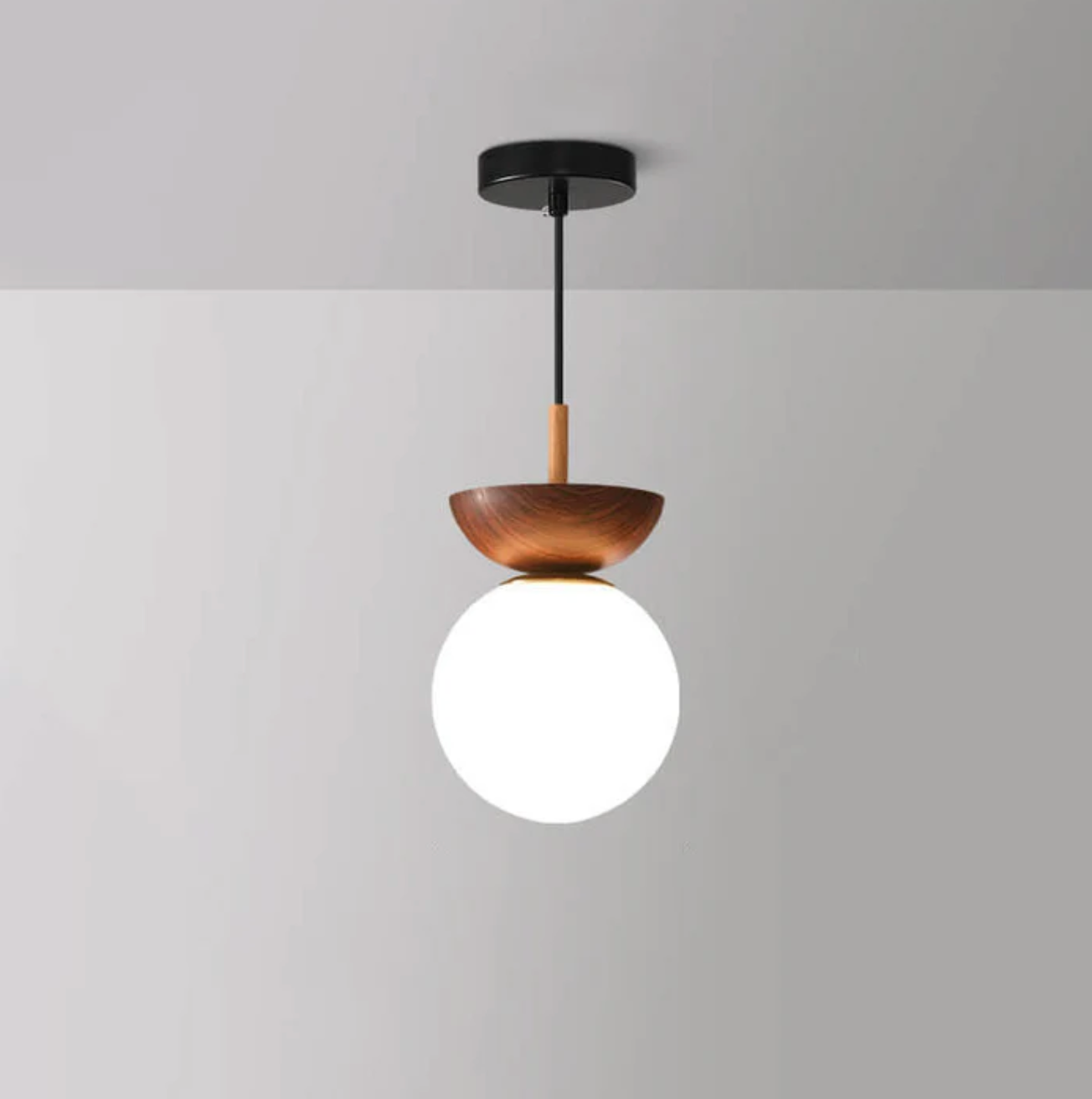 A ceiling or pendant lamp with a frosted shade and a wooden accent – minimalist elegance for any interior 3