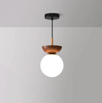 A ceiling or pendant lamp with a frosted shade and a wooden accent – minimalist elegance for any interior 3