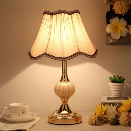 A classic table lamp with a decorative lampshade – an elegant bedside lamp in a retro style. 2