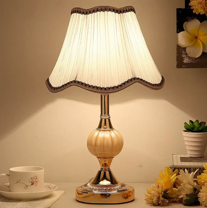 A classic table lamp with a decorative lampshade – an elegant bedside lamp in a retro style. 3