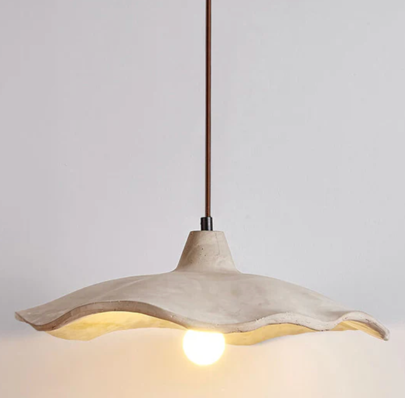 A designer pendant lamp with a concrete shade – an organic form and natural character 7
